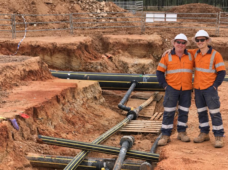 Jordan and his dad Michael on a pipeline construction site